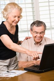 Mature couple with laptop.